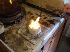 The gold was melted using a propane-oxygen torch.  The paper towel was reduced to ash.