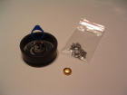 The mounted wax, 24K button, and alloy that will turn the 24K button into white gold.  The alloy contains palladium and silver.